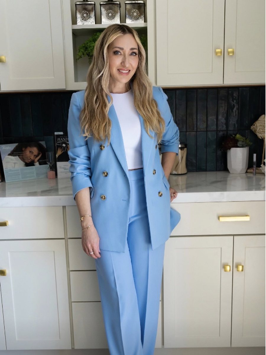 Nicole in a blue suit