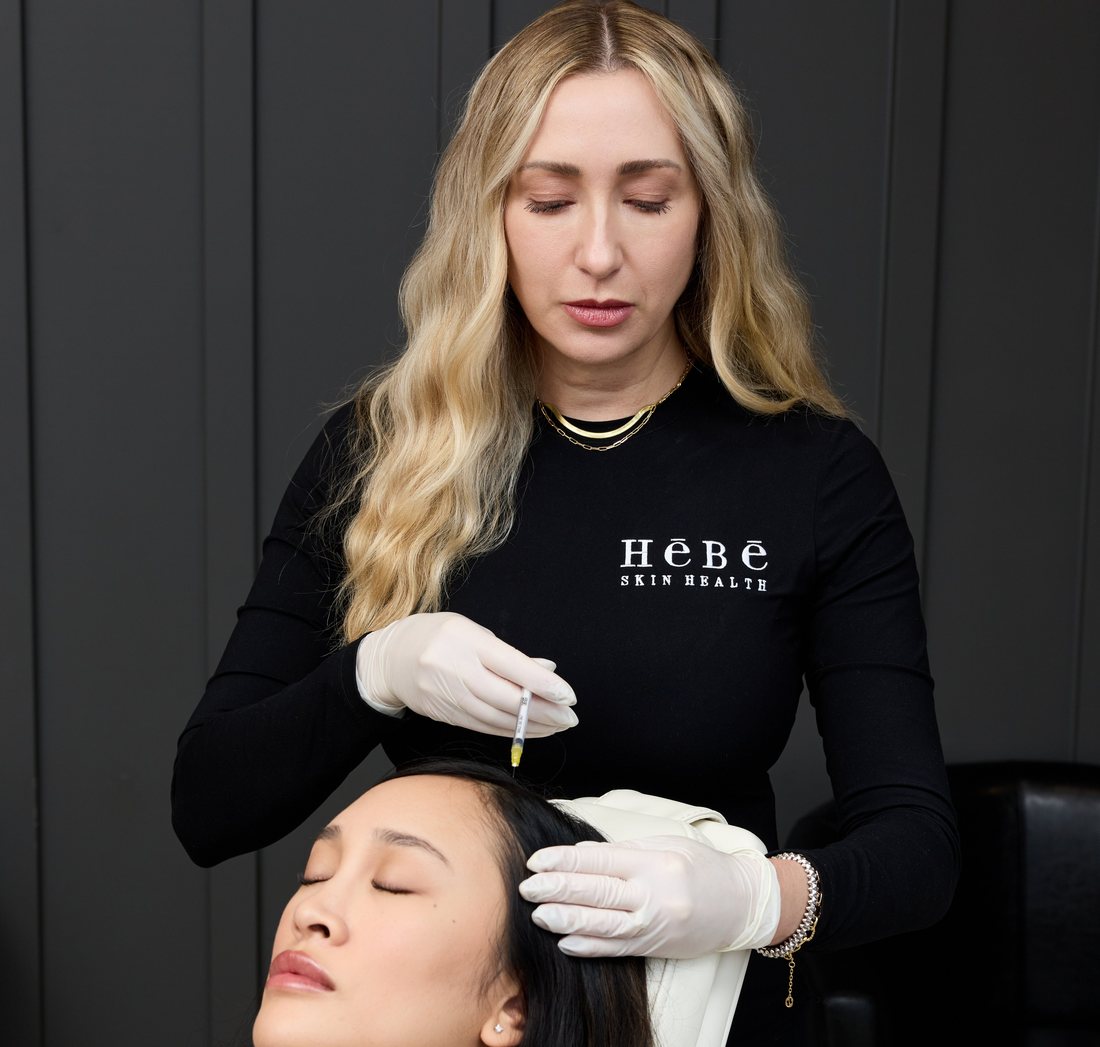 Nicole injecting a patient in the HēBē treatment room